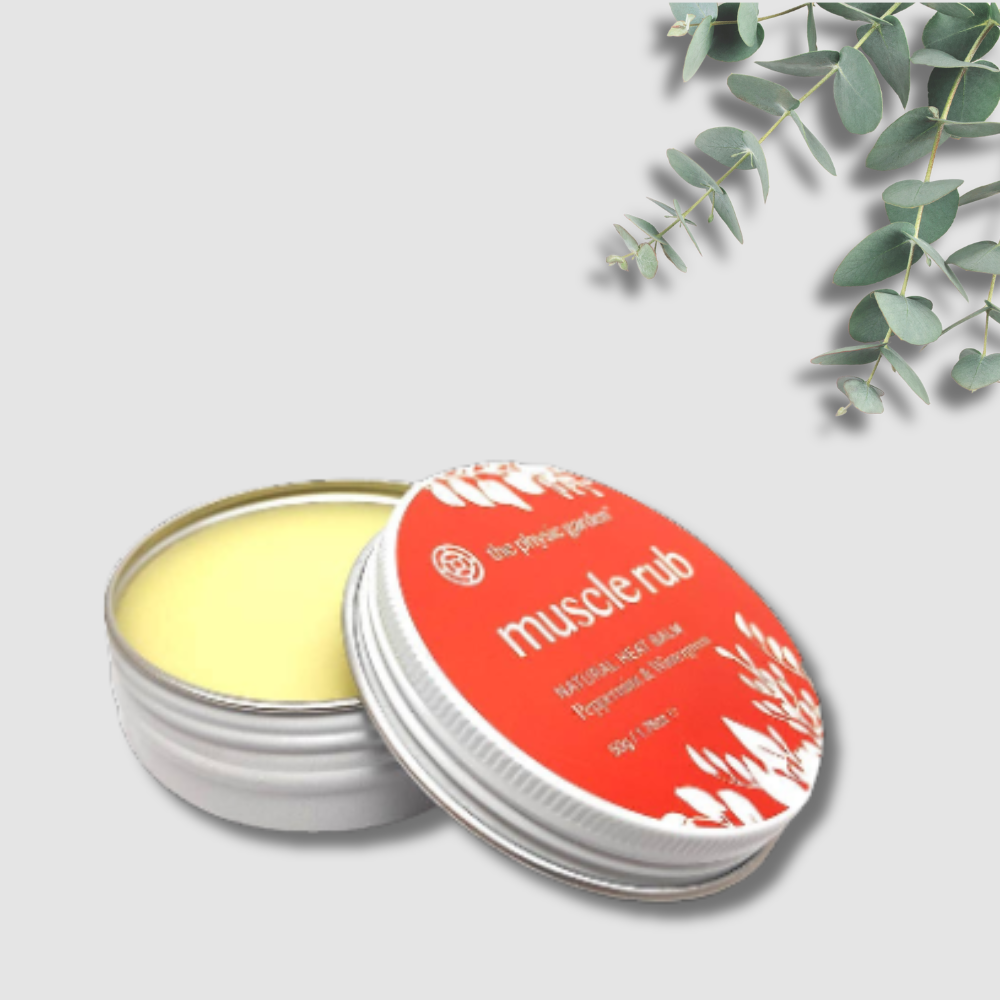 Open tin of muscle rub with red label on a light gray background