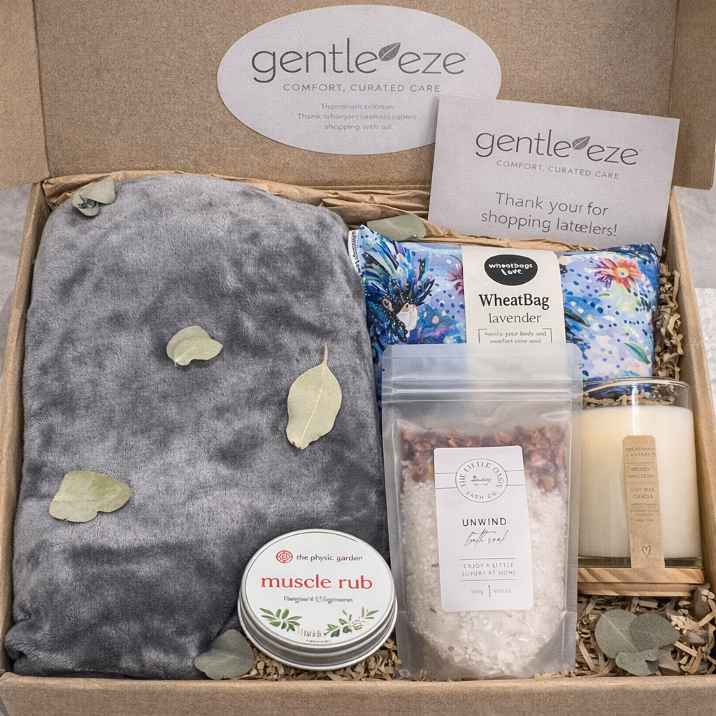 Gentle Eaze product set including a grey pillow, muscle rub, and other items in a kit box.