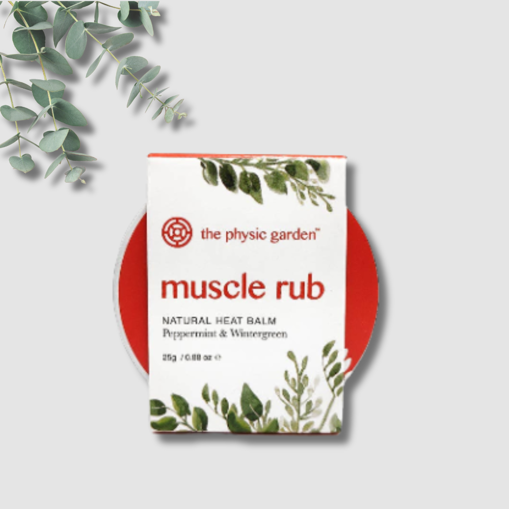 Physic Garden muscle rub packaging with eucalyptus leaves on a light gray background