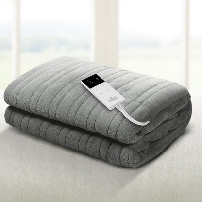 Gray electric blanket with a control panel on a light background