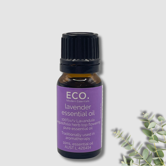 Bottle of lavender essential oil with a black cap on a light gray background