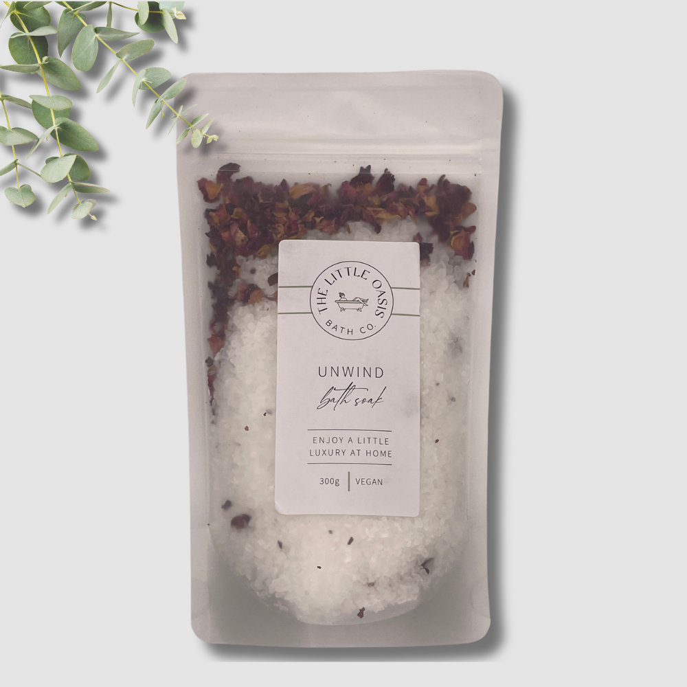 Bath salt package with eucalyptus leaves on a light gray background